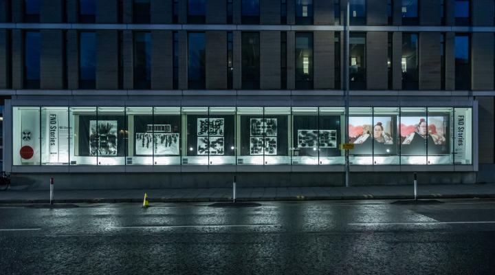 Andrew Brooks FND Stories images projected at Inspace Gallery at night.